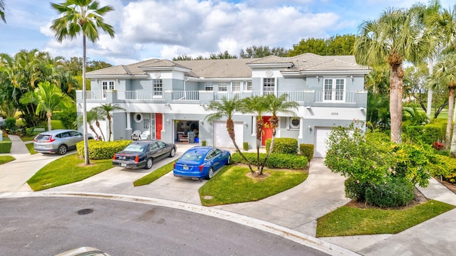 view of front of house with a balcony and a garage