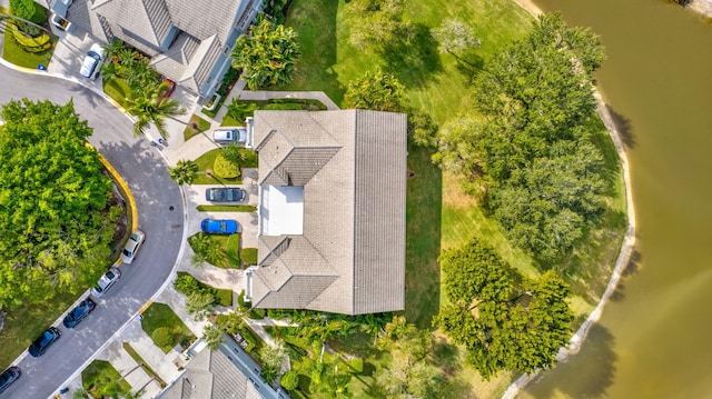 birds eye view of property with a water view