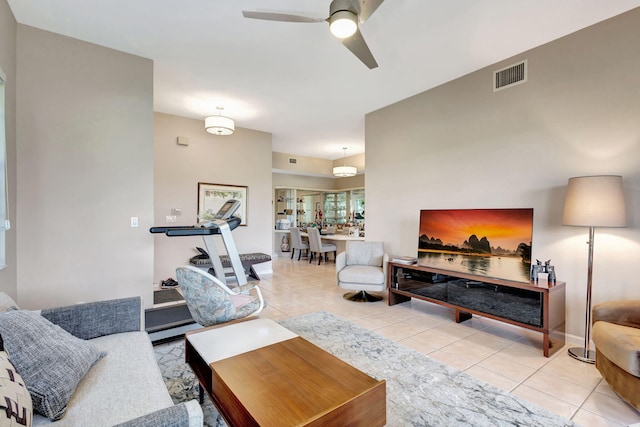 tiled living room featuring ceiling fan