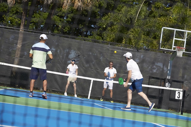 view of basketball court featuring tennis court