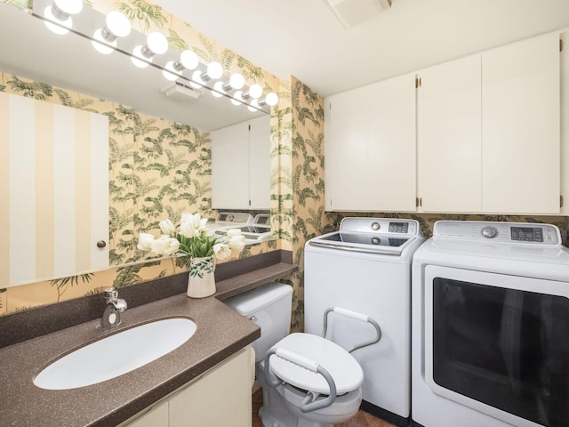 washroom featuring washer and dryer and sink