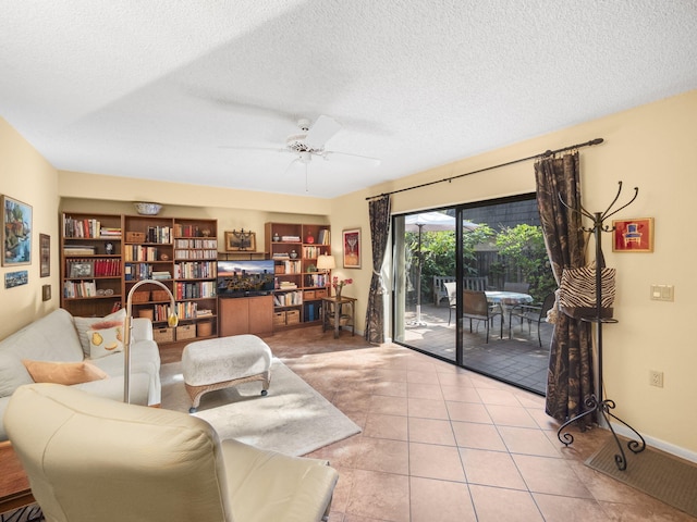 tiled living room featuring ceiling fan and a textured ceiling