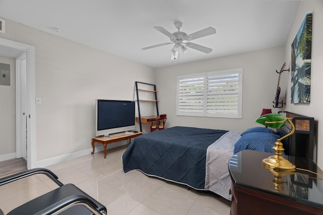 tiled bedroom featuring ceiling fan and electric panel