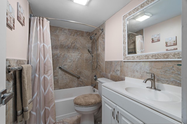 full bathroom featuring vanity, toilet, tile walls, and shower / tub combo