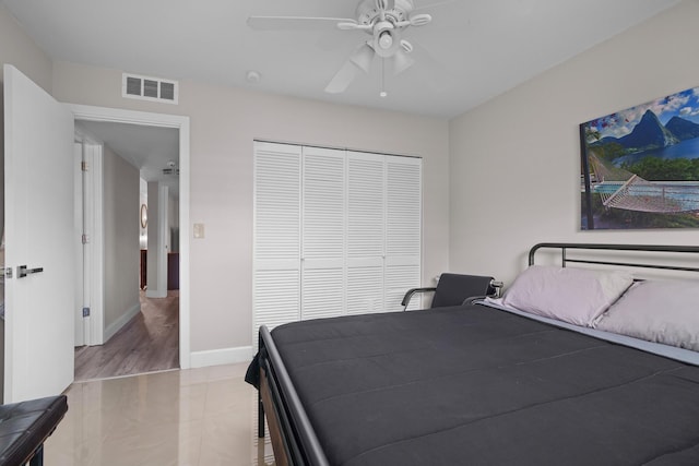 bedroom featuring ceiling fan and a closet