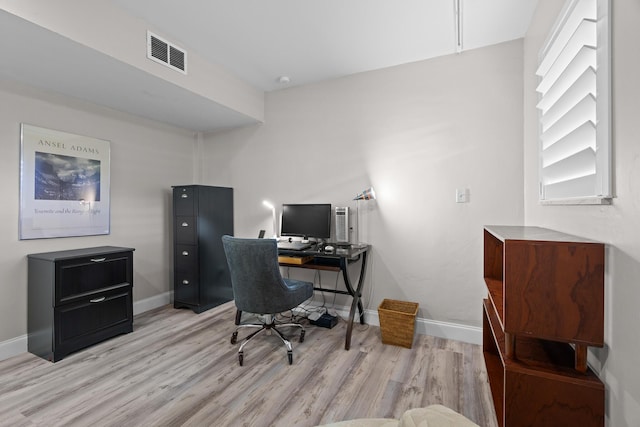 office area with light hardwood / wood-style floors