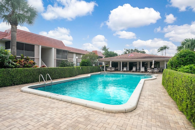 view of swimming pool featuring a patio