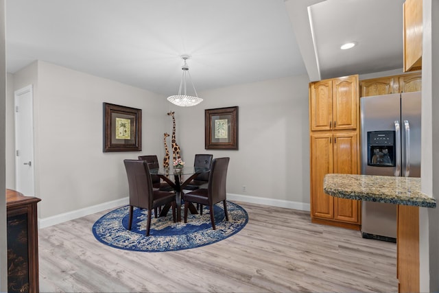 dining room with light hardwood / wood-style flooring