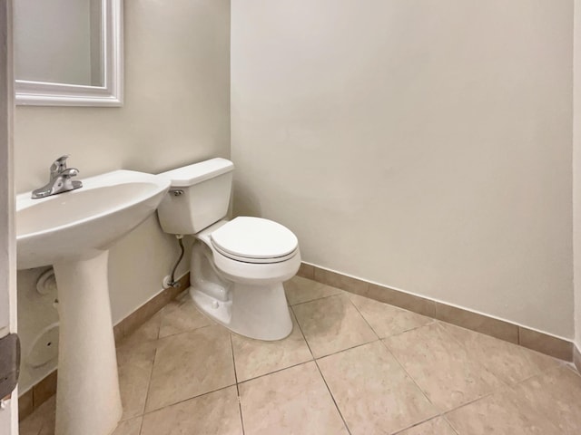 bathroom featuring tile patterned floors and toilet