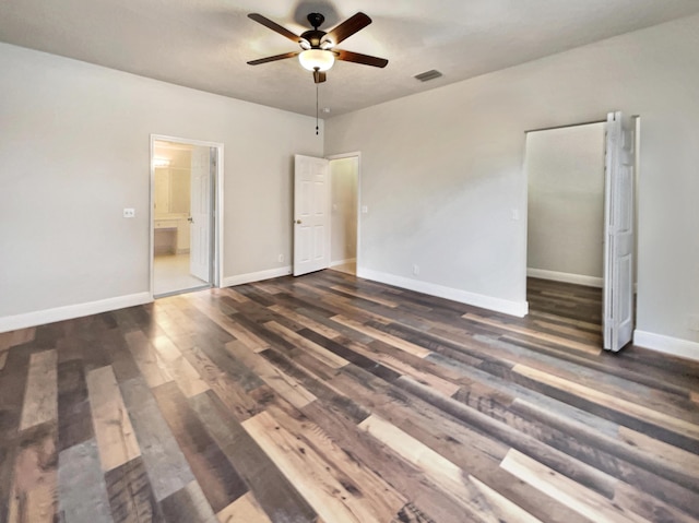 unfurnished bedroom with dark hardwood / wood-style flooring and ceiling fan