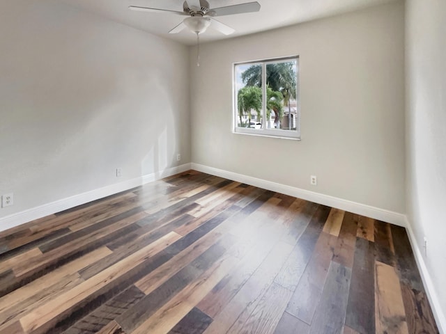 unfurnished room featuring dark hardwood / wood-style floors and ceiling fan