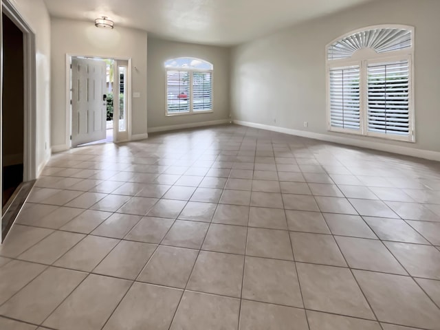 foyer featuring light tile patterned floors