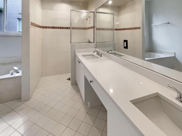 bathroom with tile patterned floors, vanity, and plus walk in shower