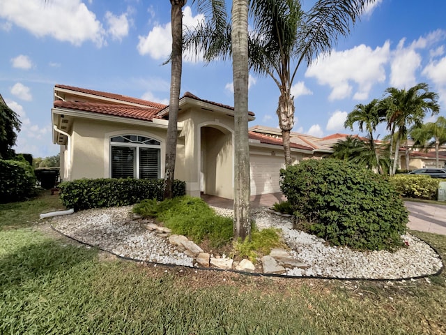 mediterranean / spanish-style home featuring a garage