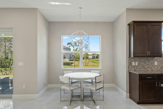 dining room featuring a notable chandelier