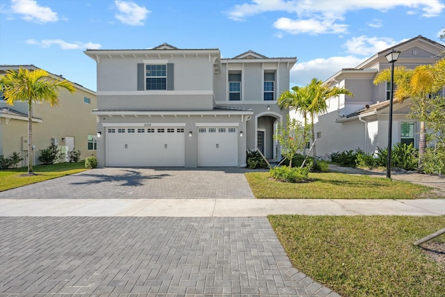 view of front facade featuring a front yard and a garage