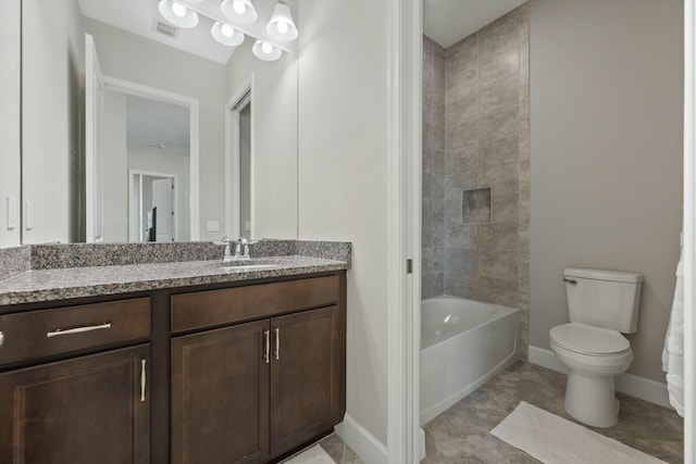 full bathroom featuring vanity, toilet, and tiled shower / bath combo