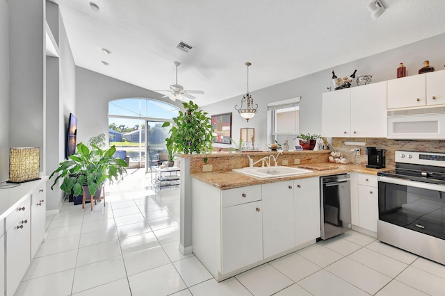 kitchen with white cabinets, kitchen peninsula, sink, and appliances with stainless steel finishes