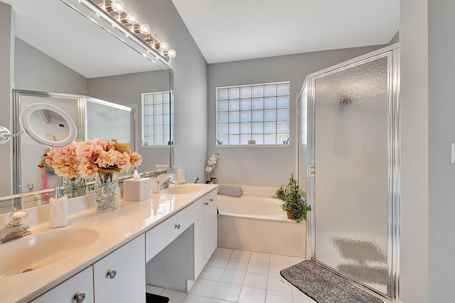 bathroom featuring tile patterned flooring, separate shower and tub, and vaulted ceiling