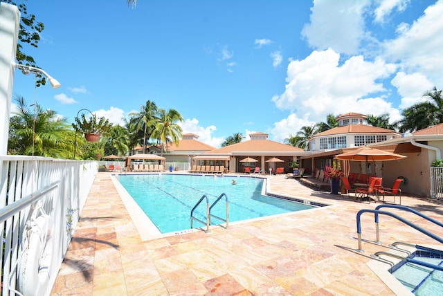 view of swimming pool featuring a patio area