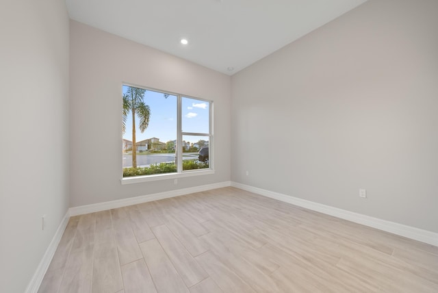 spare room with light hardwood / wood-style floors