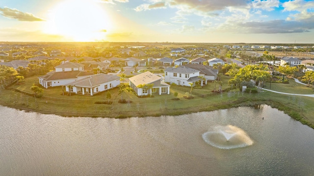 aerial view at dusk with a water view