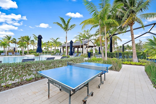 view of patio / terrace featuring a gazebo and a community pool