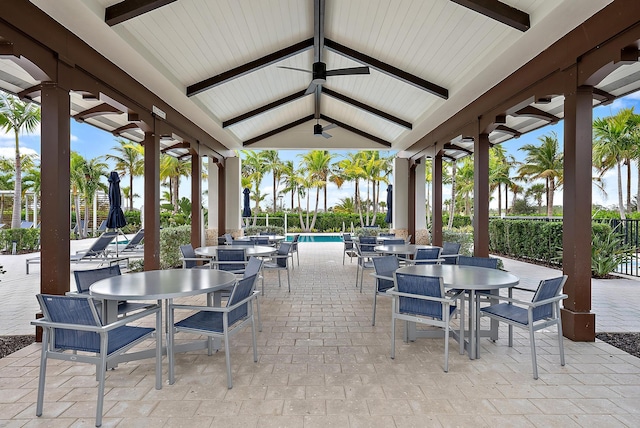 view of patio / terrace with ceiling fan and a community pool