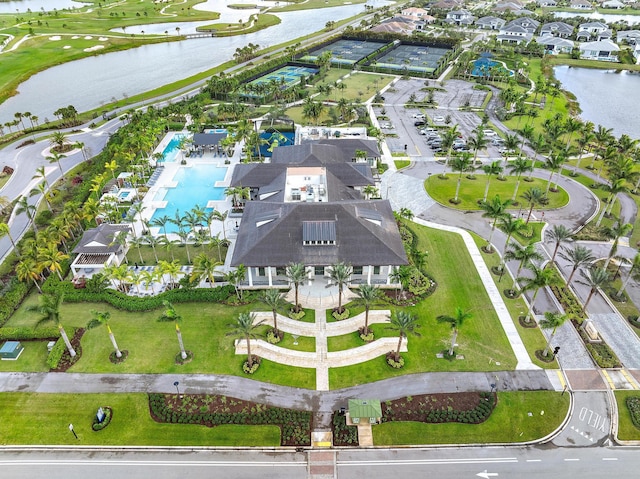 birds eye view of property with a water view