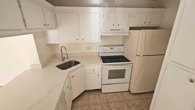 kitchen with sink, white cabinets, white appliances, and light tile patterned floors