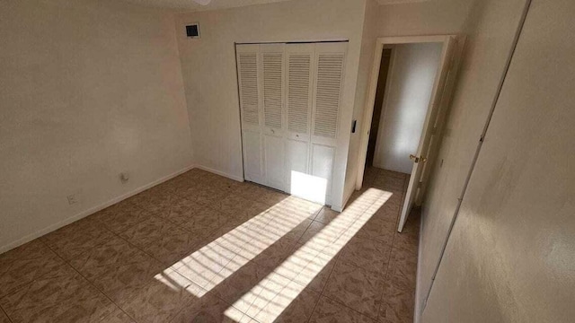 unfurnished bedroom featuring a closet