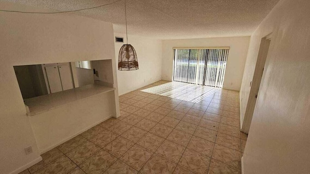 spare room featuring a textured ceiling