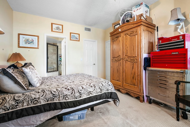 carpeted bedroom featuring a textured ceiling