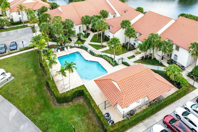 birds eye view of property with a water view