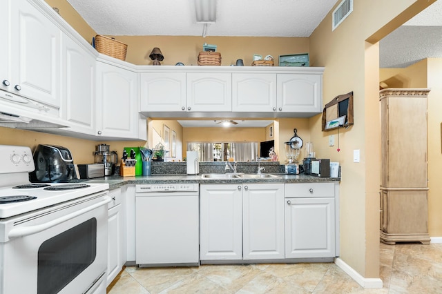 kitchen with white cabinetry, sink, extractor fan, and white appliances