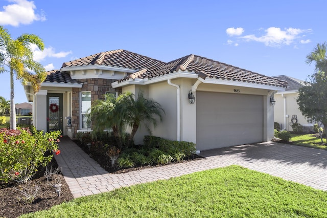 mediterranean / spanish-style home featuring a garage