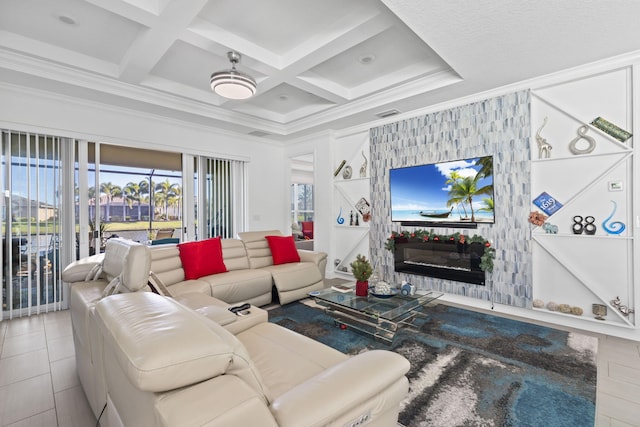 tiled living room with beam ceiling, a large fireplace, ornamental molding, and coffered ceiling