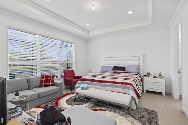 tiled bedroom with crown molding and a tray ceiling