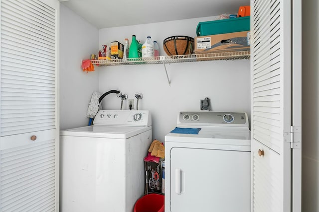 clothes washing area with washer and dryer