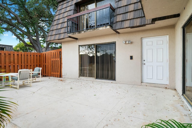 exterior space with a patio and a balcony