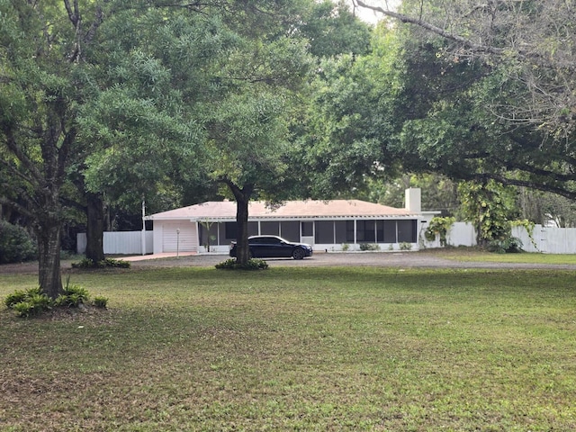 ranch-style house with a front lawn