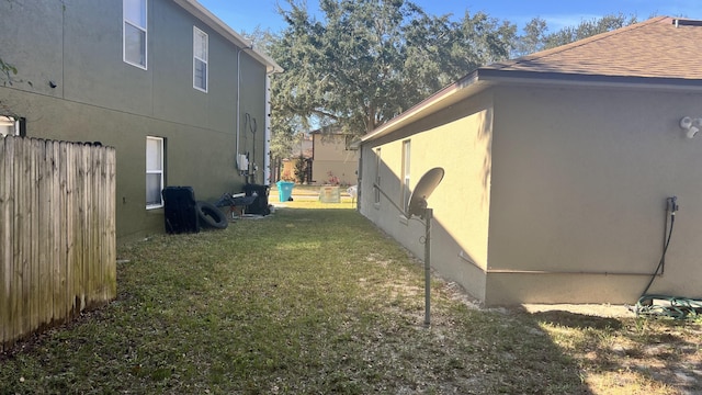 view of home's exterior with a yard