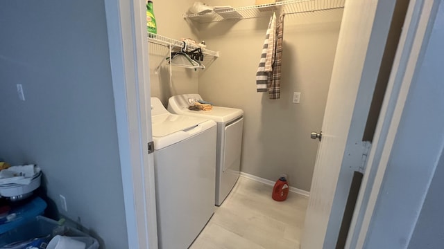 laundry room featuring washer and clothes dryer