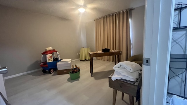 bedroom featuring ceiling fan and wood-type flooring