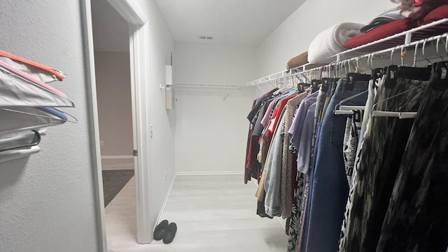 walk in closet featuring light wood-type flooring