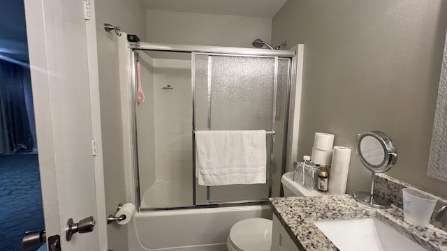 full bathroom featuring vanity, toilet, and enclosed tub / shower combo