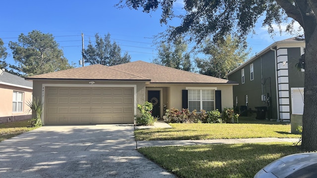 ranch-style house with a garage and a front yard