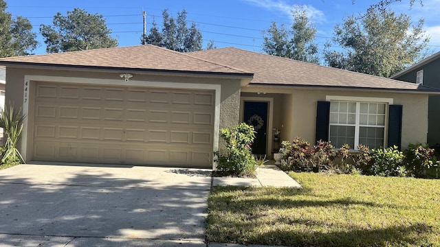 ranch-style house with a garage and a front lawn