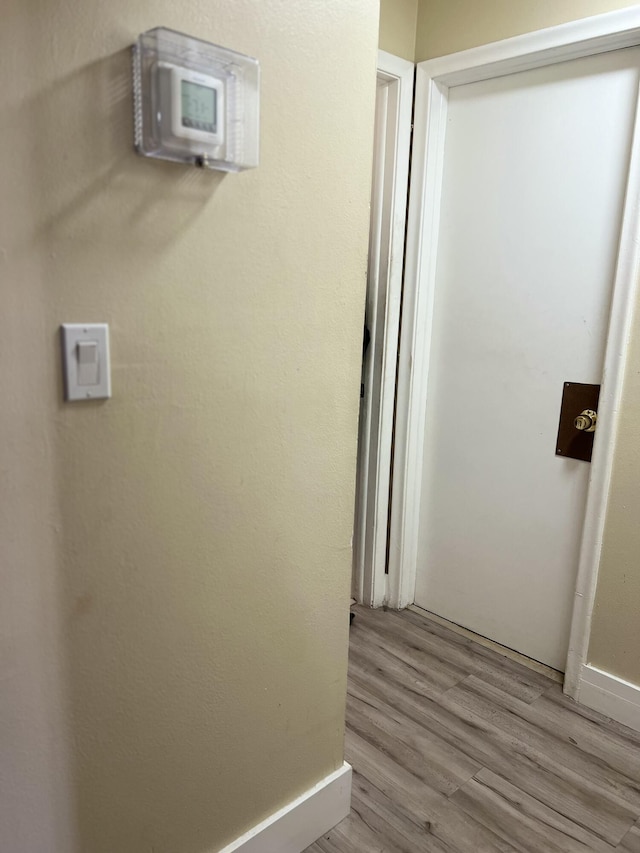 hallway featuring light wood-type flooring