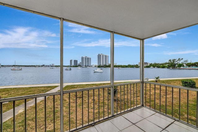 unfurnished sunroom with a water view